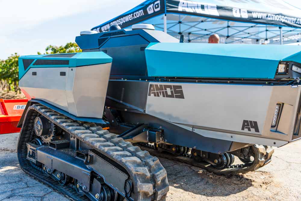 hero image of a Amos Power tractor showing the tracks.