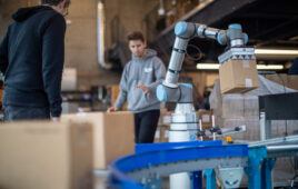 A UR cobot performs a place operation.